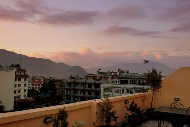 Rooftop terrace at sunset over the valley